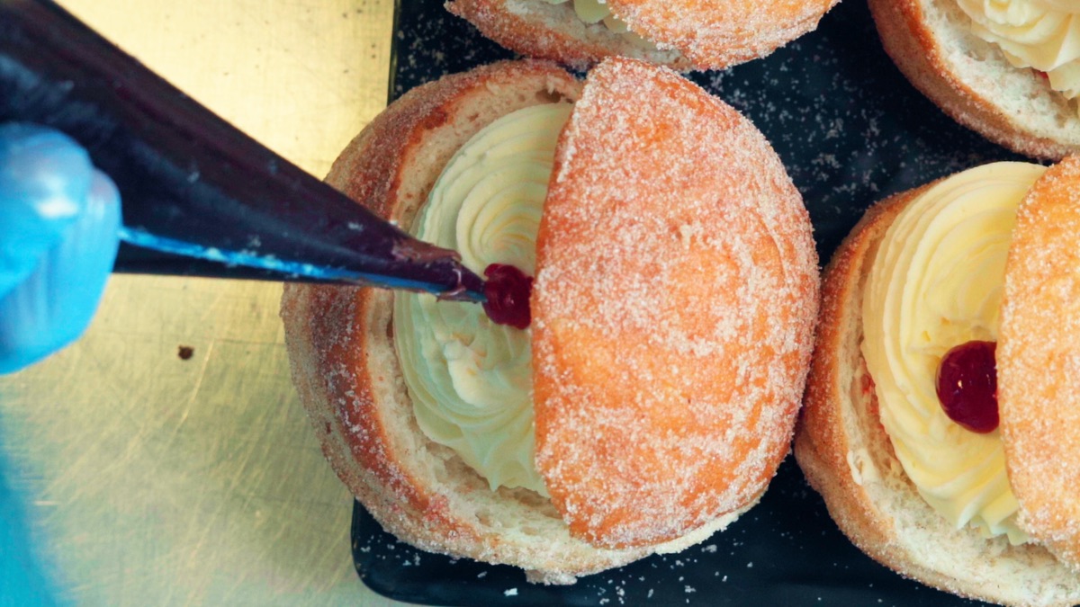 Kitchener bun being filled